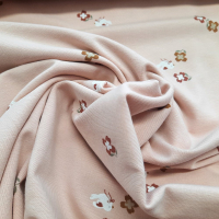 Baumwolljersey beige mit Täubchen und Blümchen